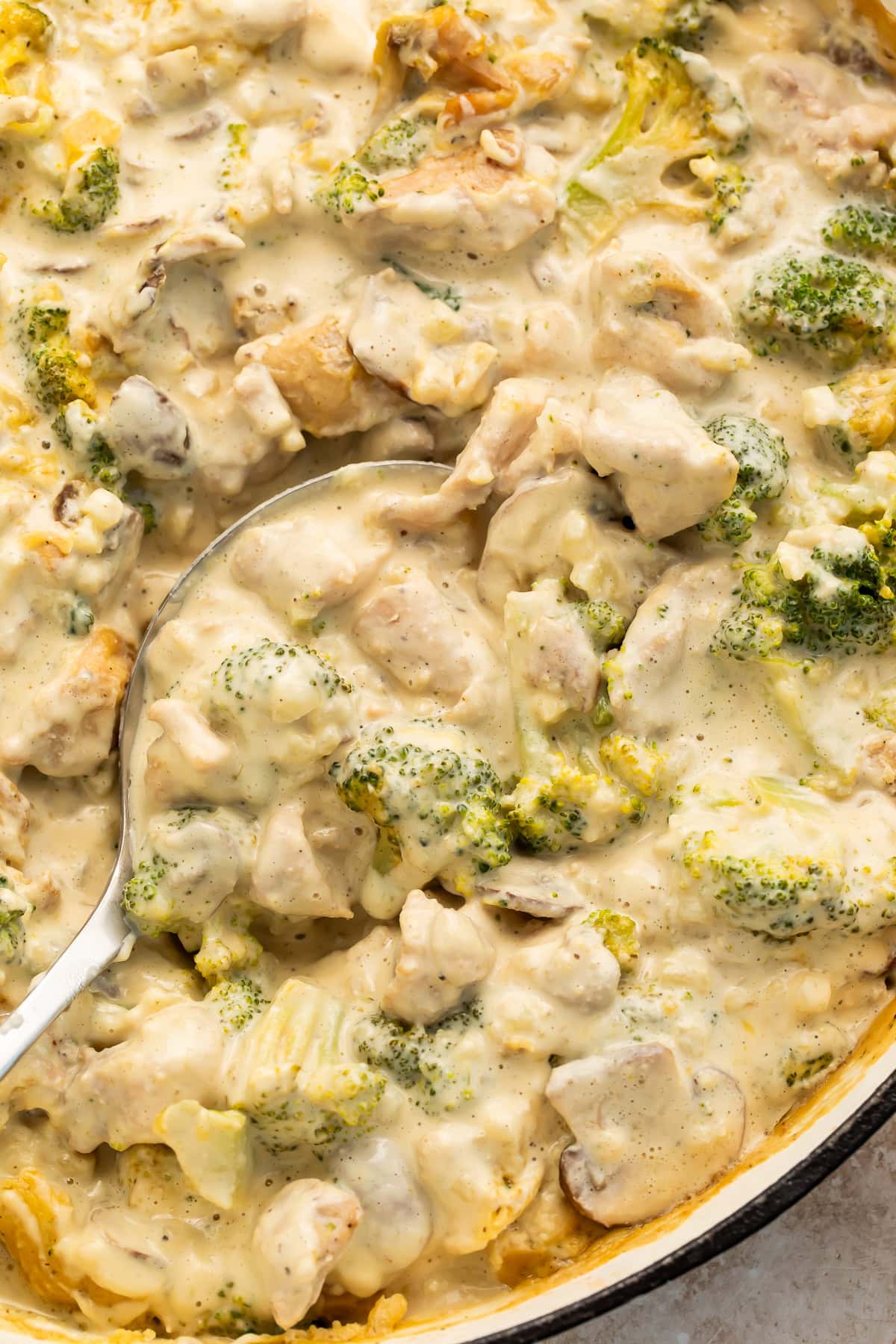Close-up of Whole30 creamy chicken casserole showing sauce coating broccoli and chicken pieces