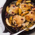 These paleo cranberry apple chicken thighs with rosemary are such a delicious paleo fall recipe. With organic cranberry juice and dried cranberries, these paleo cranberry apple chicken thighs are an easy and quick paleo dinner that's elegant enough for company.