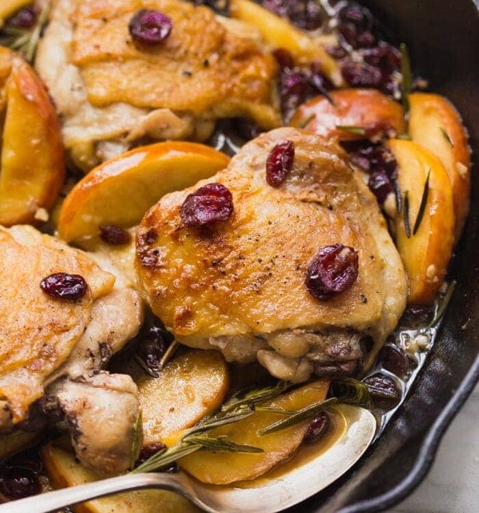 These paleo cranberry apple chicken thighs with rosemary are such a delicious paleo fall recipe. With organic cranberry juice and dried cranberries, these paleo cranberry apple chicken thighs are an easy and quick paleo dinner that’s elegant enough for company.