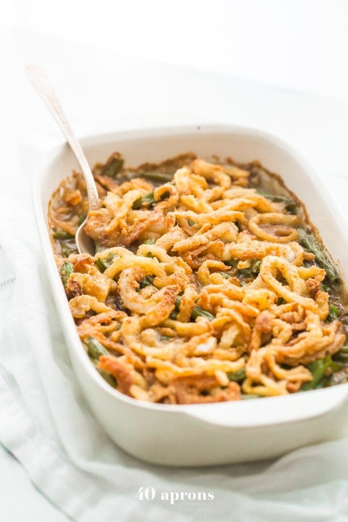 This Whole30 green bean casserole is just like the classic Thanksgiving dish: tender green beans in a rich cream of mushroom sauce, topped with fried onion straws. This Whole30 green bean casserole (also a paleo green bean casserole, of course!) is an absolute must for the Whole30 Thanksgiving table. And to be honest, this paleo green bean casserole tastes even better than the classic version! 