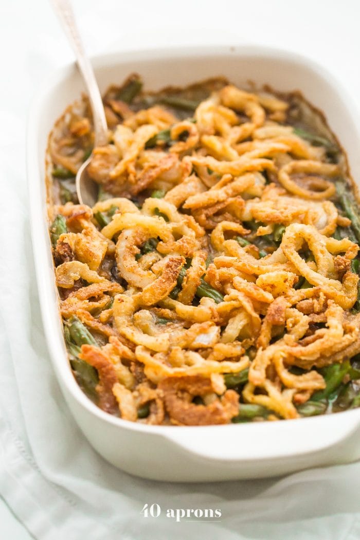 This Whole30 green bean casserole is just like the classic Thanksgiving dish: tender green beans in a rich cream of mushroom sauce, topped with fried onion straws. This Whole30 green bean casserole (also a paleo green bean casserole, of course!) is an absolute must for the Whole30 Thanksgiving table. And to be honest, this paleo green bean casserole tastes even better than the classic version! 