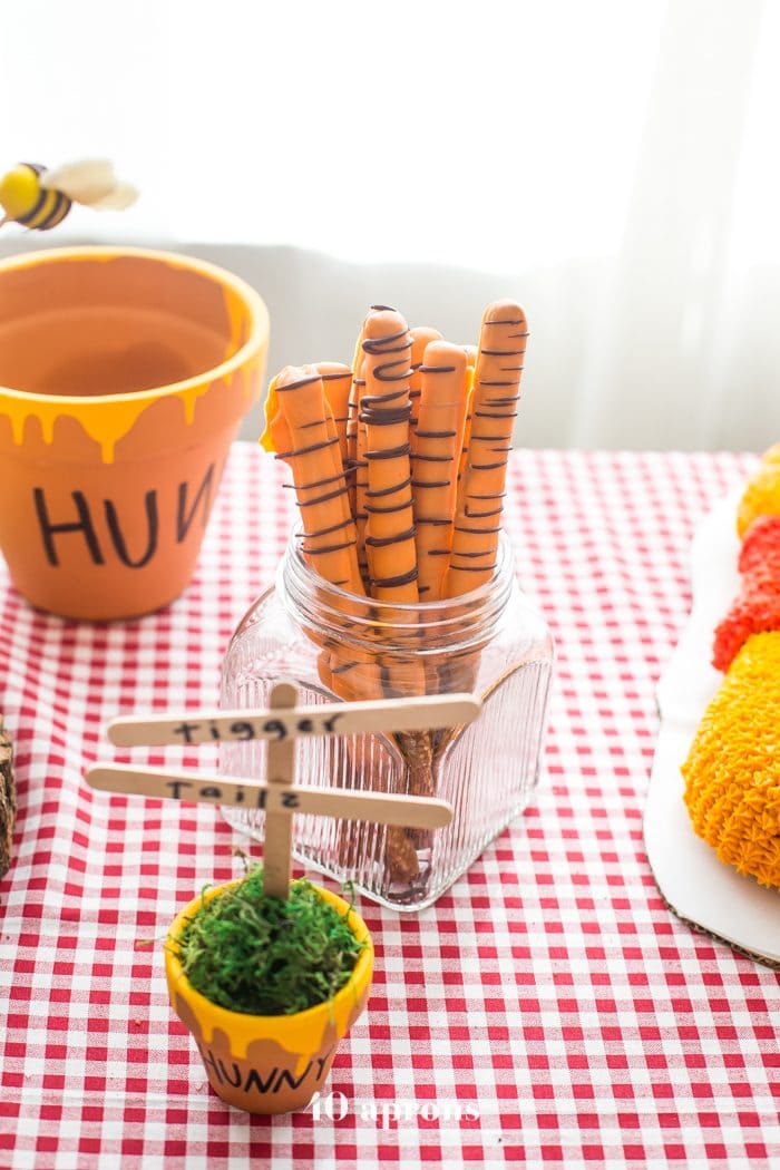 This DIY Winnie the Pooh birthday party is too cute! With tons of Winnie the Pooh birthday party ideas, this is your Winnie the Pooh birthday party guide. Happy birthday, little one! It'd make a great Winnie the Pooh baby shower, too.