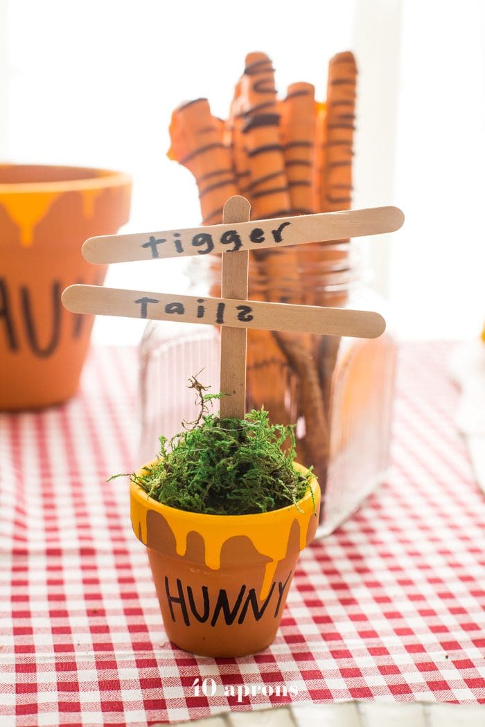 This DIY Winnie the Pooh birthday party is too cute! With tons of Winnie the Pooh birthday party ideas, this is your Winnie the Pooh birthday party guide. Happy birthday, little one! It'd make a great Winnie the Pooh baby shower, too.