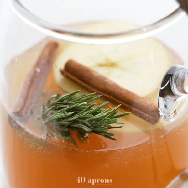 Cinnamon apple cider mimosa in a jug