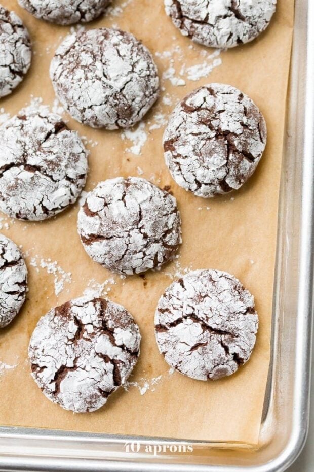 These peppermint paleo gluten-free crinkle cookies are fudgy and rich, perfect for the holidays. Grain-free and refined-sugar-free, these paleo gluten-free crinkle cookies are a guilt-free way to indulge in holiday treats without breaking your commitment to a healthier lifestyle. These paleo gluten-free crinkle cookies have hints of peppermint, making them positively festive. Your friends and family will never believe these gluten-free crinkle cookies are paleo!