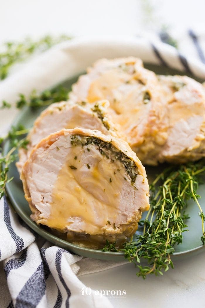 This Whole30 Instant Pot turkey breast with gravy is quick, so delicious, and totally Whole30 compliant. Brined with a garlic-herb butter under the skin, this Whole30 turkey breast and the gravy are both made in the Instant Pot, making Thanksgiving easier! You'll love this Whole30 Instant Pot turkey breast and gravy, because the meat is so tender, and the gravy is so easy. Perfect for any Whole30 Thanksgiving or paleo Thanksgiving table. 