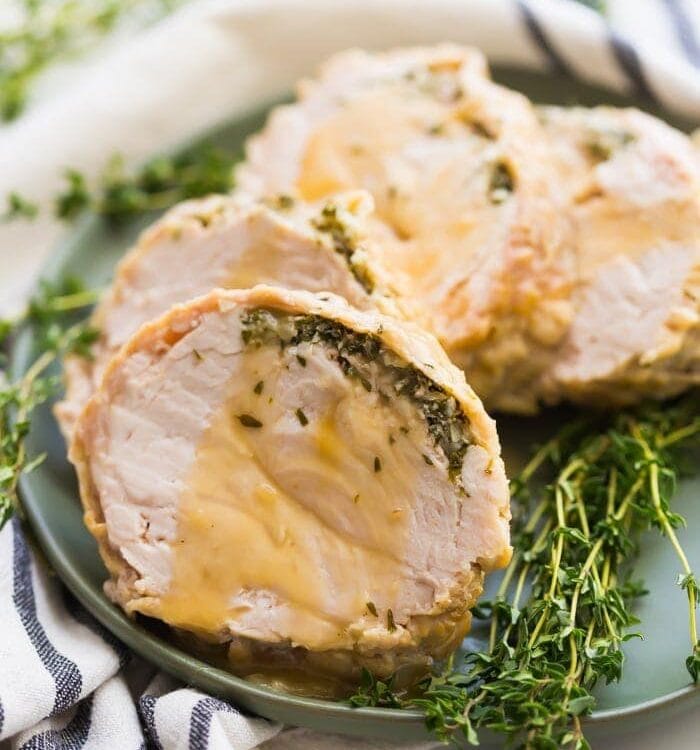 This Whole30 Instant Pot turkey breast with gravy is quick, so delicious, and totally Whole30 compliant. Brined with a garlic-herb butter under the skin, this Whole30 turkey breast and the gravy are both made in the Instant Pot, making Thanksgiving easier! You'll love this Whole30 Instant Pot turkey breast and gravy, because the meat is so tender, and the gravy is so easy. Perfect for any Whole30 Thanksgiving or paleo Thanksgiving table. 