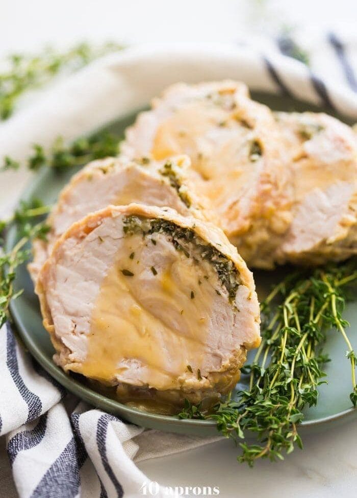 This Whole30 Instant Pot turkey breast with gravy is quick, so delicious, and totally Whole30 compliant. Brined with a garlic-herb butter under the skin, this Whole30 turkey breast and the gravy are both made in the Instant Pot, making Thanksgiving easier! You'll love this Whole30 Instant Pot turkey breast and gravy, because the meat is so tender, and the gravy is so easy. Perfect for any Whole30 Thanksgiving or paleo Thanksgiving table. 