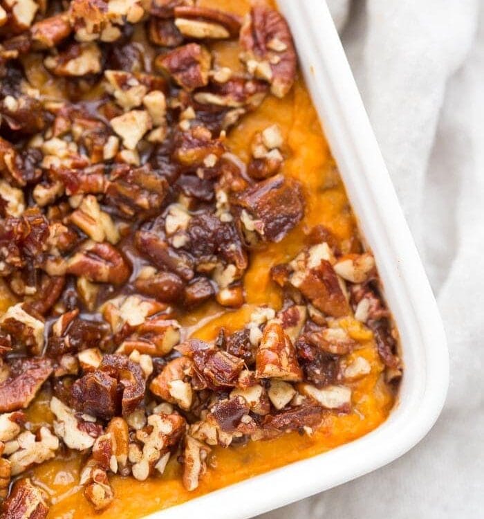This Whole30 sweet potato casserole with pecans is a must for any Whole30 Thanksgiving table! With no sweeteners and a cinnamon pecan-date topping, you might end up eating the leftovers for breakfast (we did!). This Whole30 sweet potato casserole is naturally sweetened and just so delicious. A new Whole30 Thanksgiving classic! 