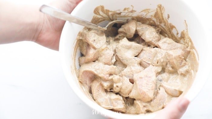 Marinate the chicken in yogurt and spices