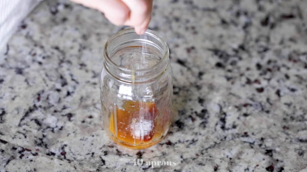 Combine concentrate, sesame oil, hot sauce, and salt in a mason jar