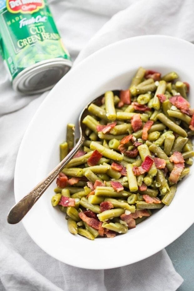 Whole30 Del Monte green beans with bacon in a white dish