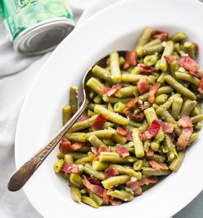 Whole30 Del Monte green beans with bacon in a white dish