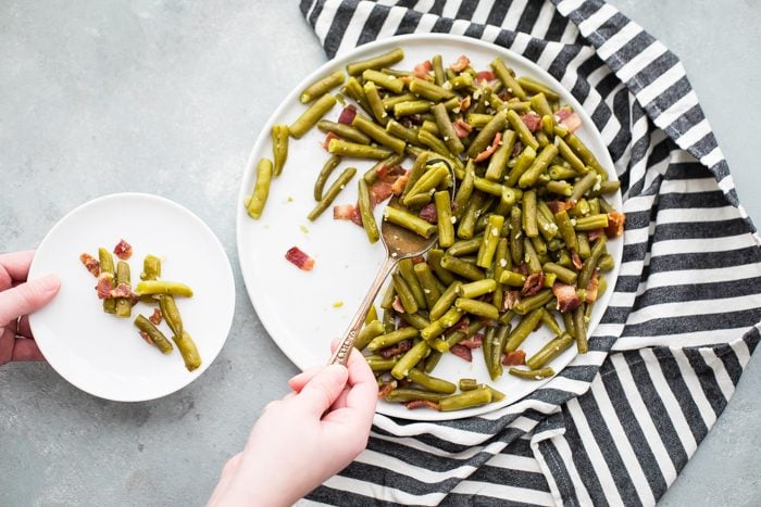 Whole30 Del Monte green beans with bacon in a white dish