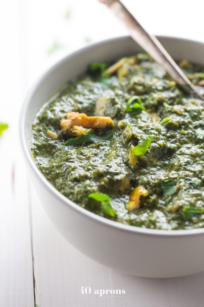 Whole30 Indian saag chicken in a white bowl