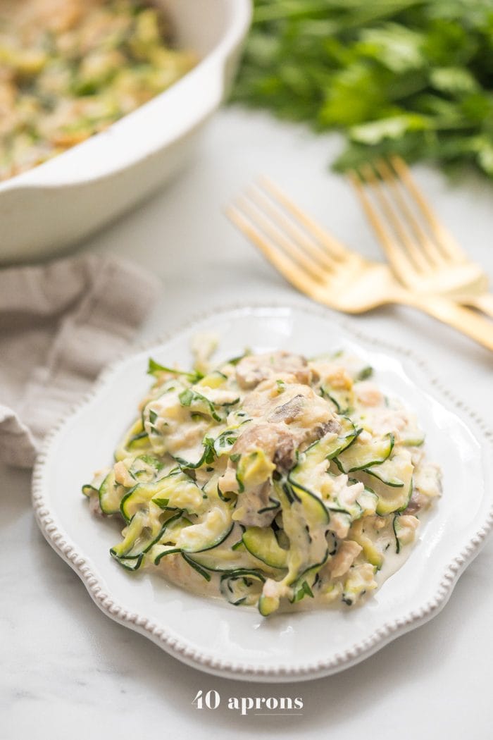 Whole30 tuna zoodle casserole on a plate next to a casserole