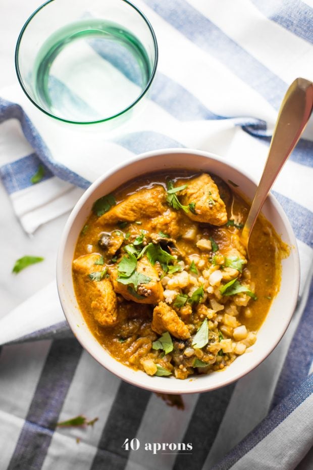 Whole30 chicken curry in a bowl with cauliflower rice