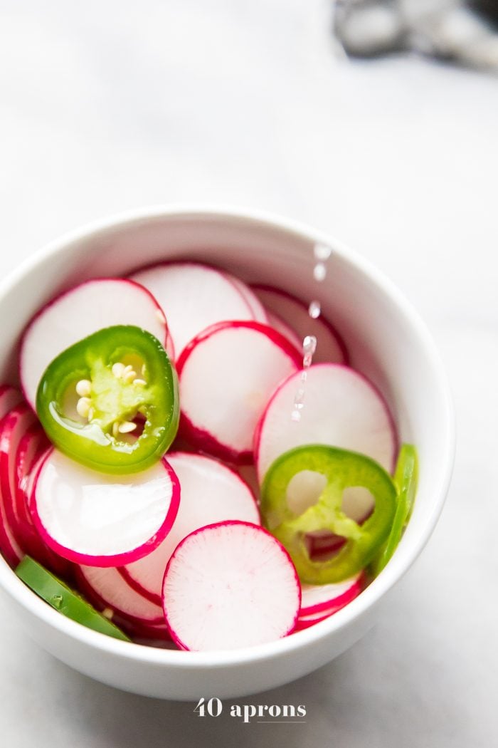 Pour a vinegar and water mixture over fresh sliced radishes and jalapenos for a quick pickle