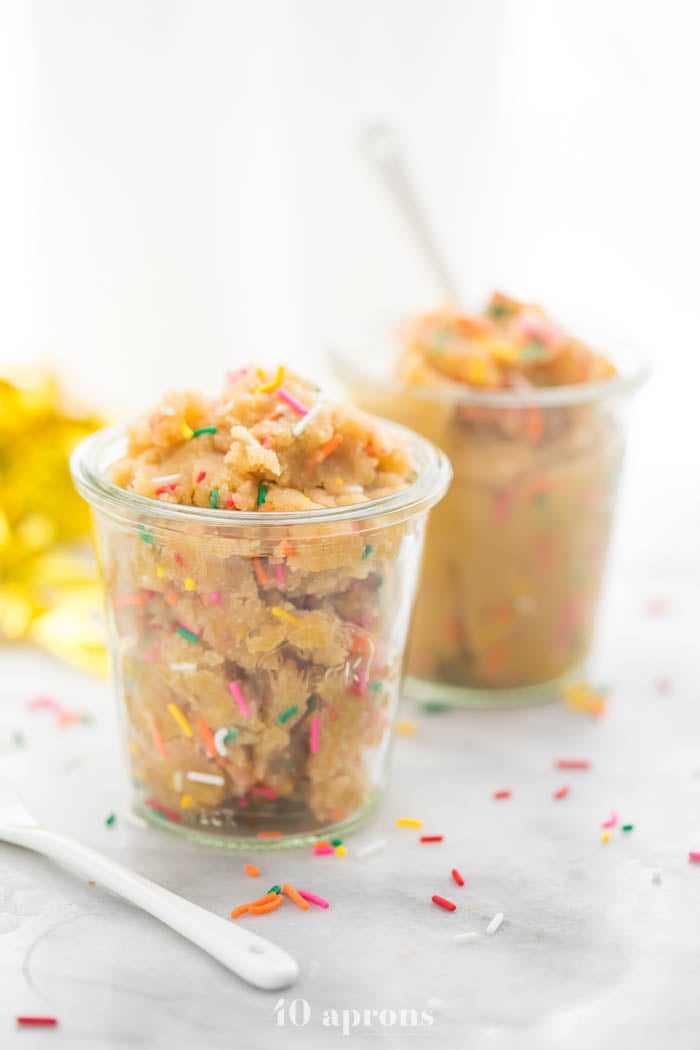 Side view of edible healthy cake batter dip (paleo and vegan) in glass jars