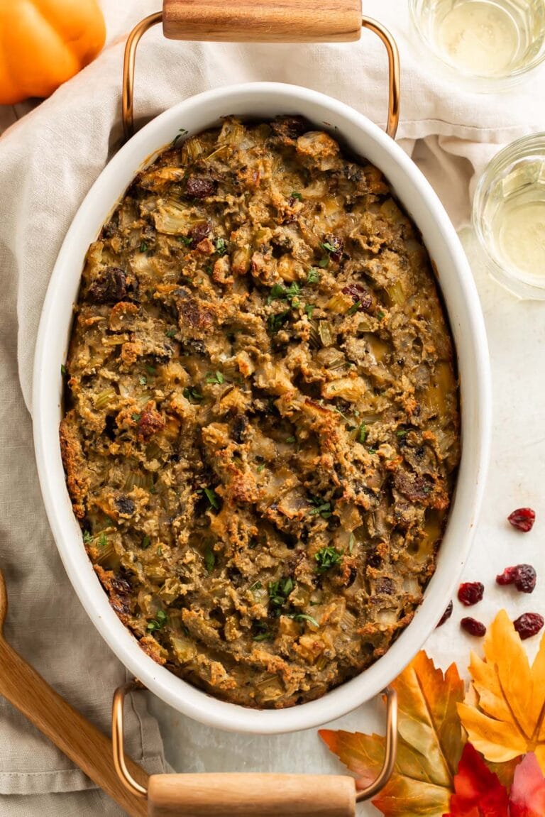 Top-down view of a large oval casserole dish holding a paleo stuffing, made without any grains.