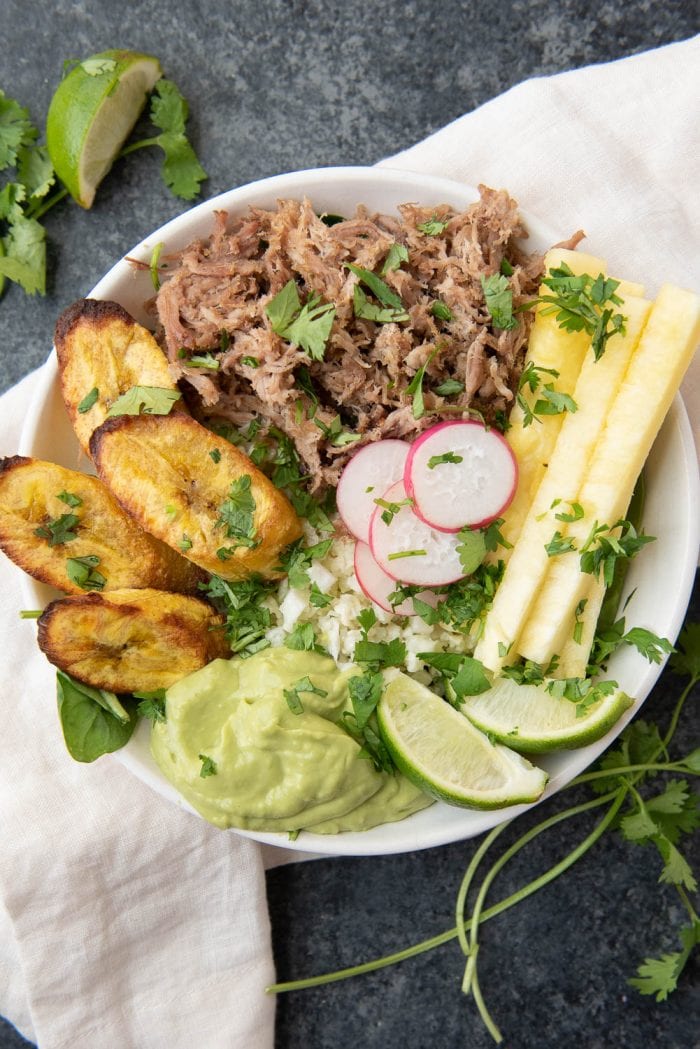 Whole30 pork and pineapple bowls with plantains, coconut cauliflower rice, and avocado lime mousse