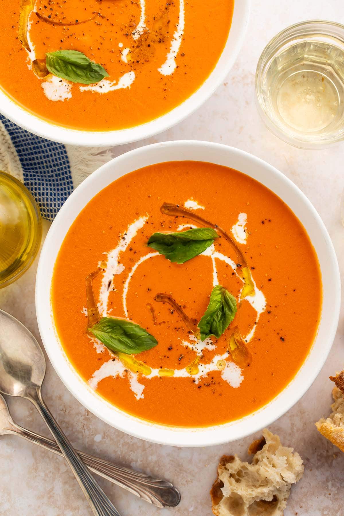 Two bowls of Instant Pot tomato soup on a table.