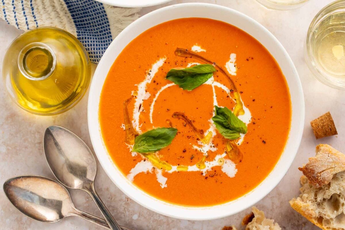 Two bowls of Instant Pot tomato soup on a table.