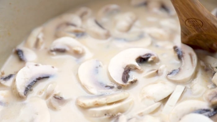 Simmer chicken, mushrooms, and coconut milk