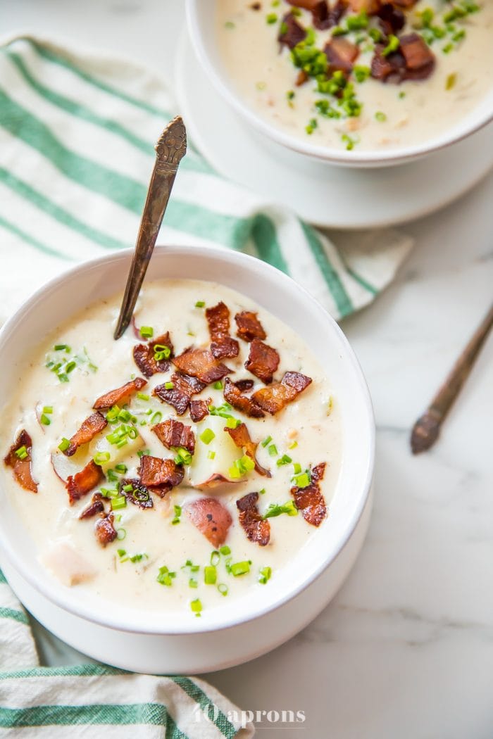 Healthy clam chowder in a white bowl