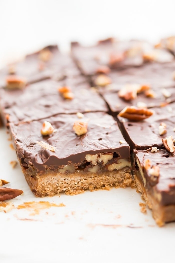 Healthy treats for Christmas baking Batch of healthy paleo and vegan turtle bars on parchment paper