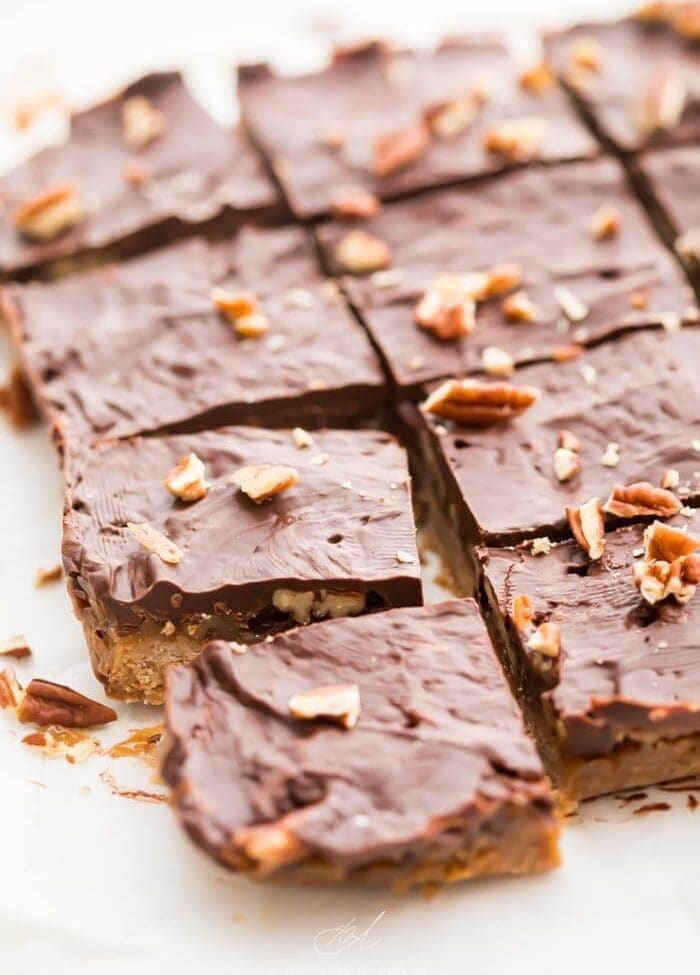 Batch of healthy paleo and vegan turtle bars on parchment paper