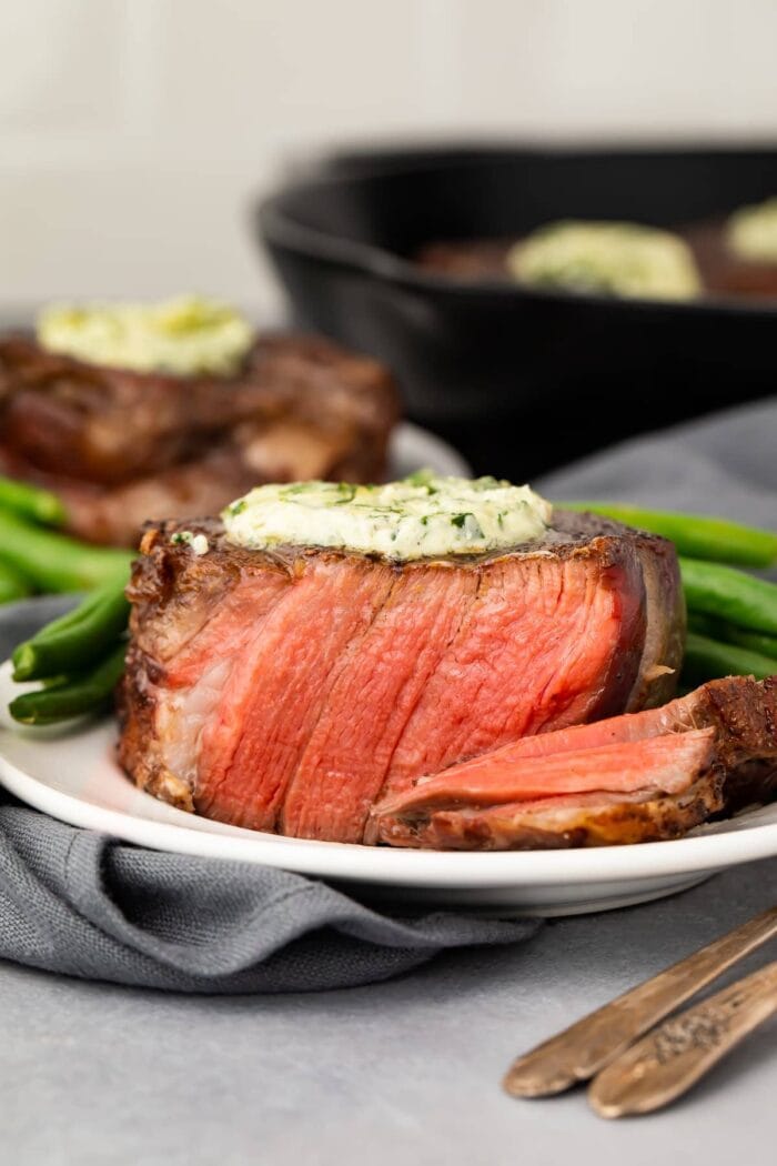 Sliced filet mignon on a white plate