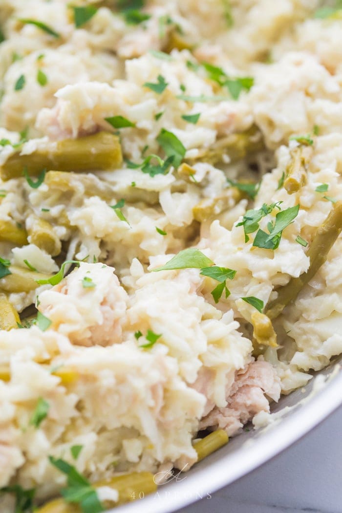 Close up shot of quick Whole30 cauliflower risotto with chicken and asparagus