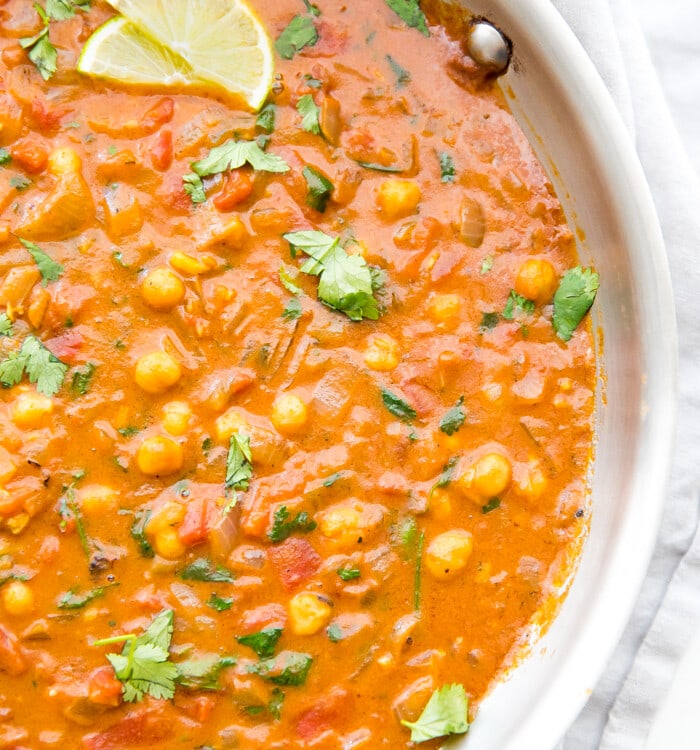 Simmer creamy vegan coconut chickpea curry until rich and reduced slightly