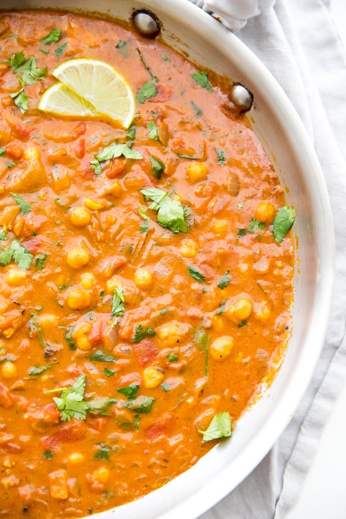 Simmer creamy vegan coconut chickpea curry until rich and reduced slightly