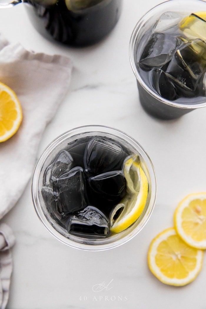 Two glasses of charcoal lemonade overhead