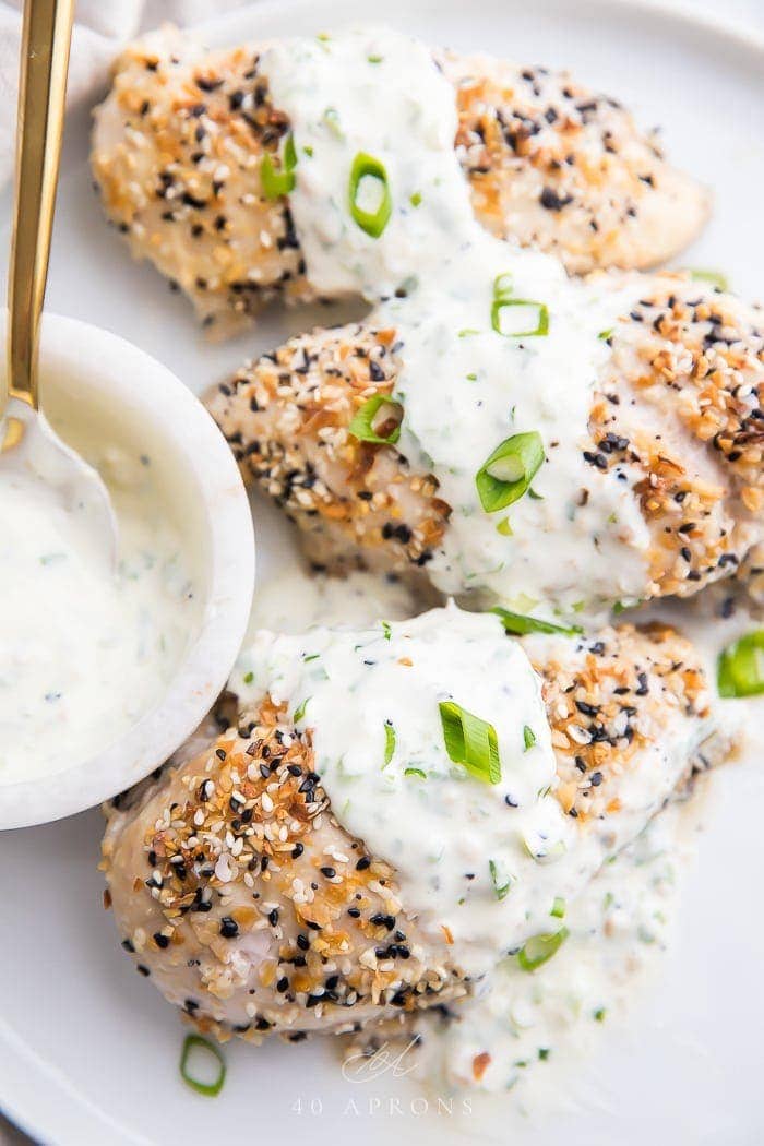 Chicken with everything bagel seasoning topped with scallion cream cheese sauce