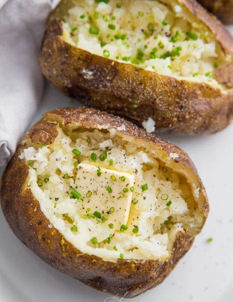 Baked potatoes on the grill.