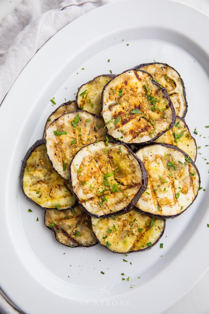 Premium Photo  Cook cuts the eggplant according to the recipe, on