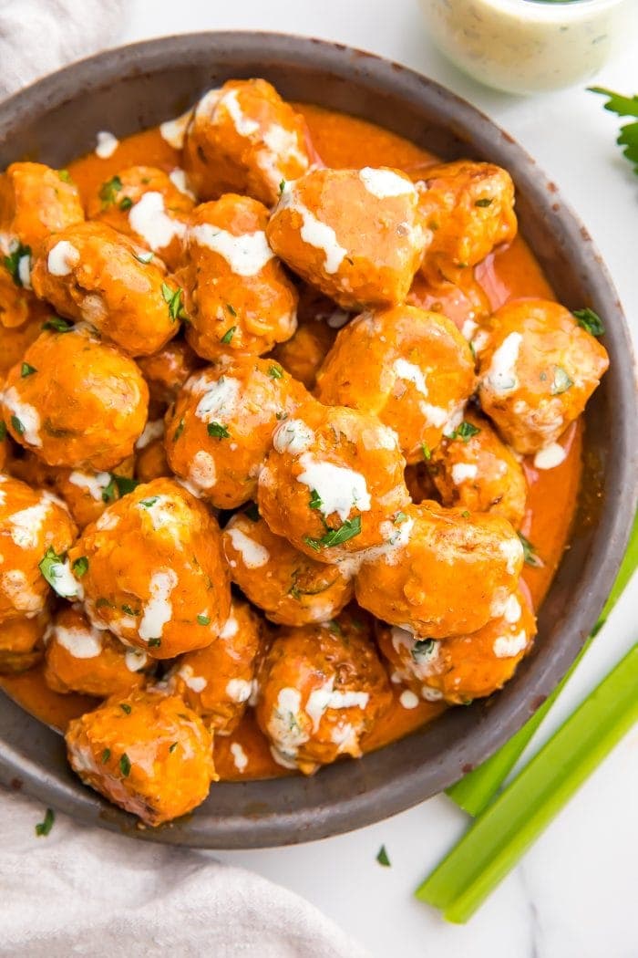 Buffalo Chicken Meatballs served in a bowl with ranch dressing