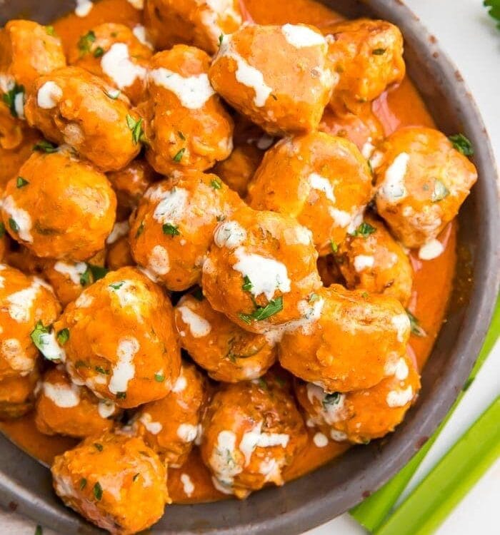 Buffalo Chicken Meatballs served in a bowl with ranch dressing