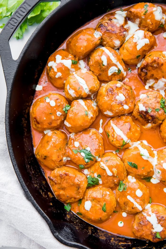 Top down shot of buffalo chicken meatballs in a skillet