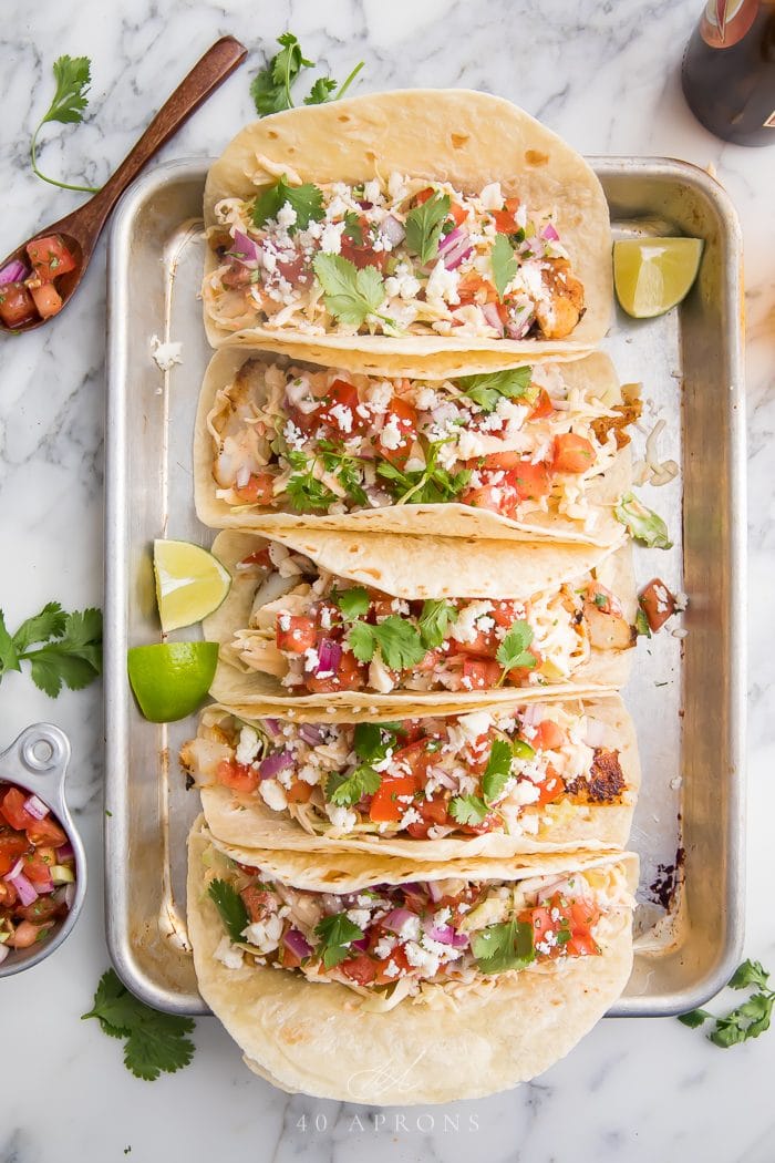 Five easy fish tacos on a silver tray