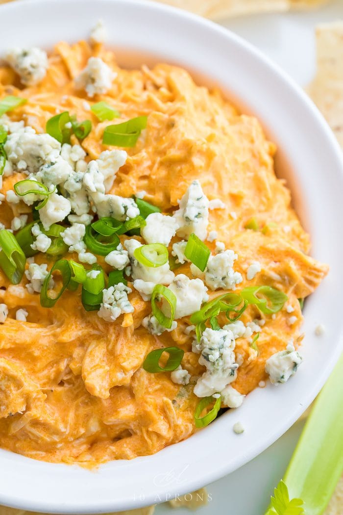 Close up of buffalo chicken dip with toppings