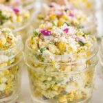 Close up of Mexican street corn in jars