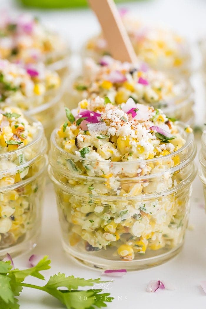 Close up of Mexican street corn in jars