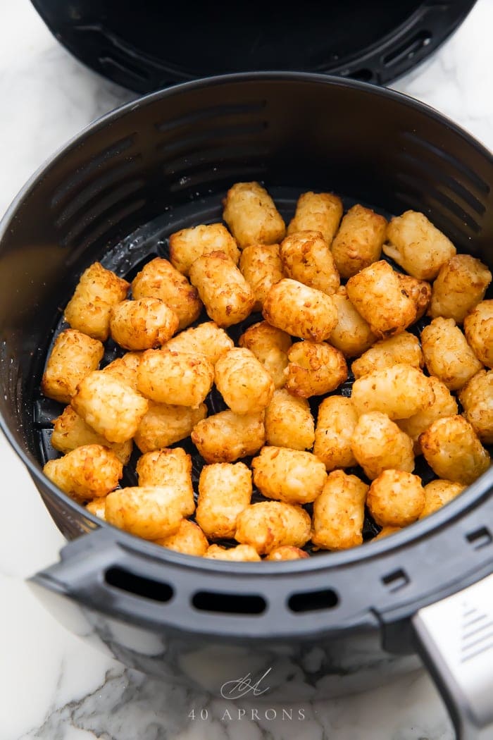 Cooked tater tots in an air fryer