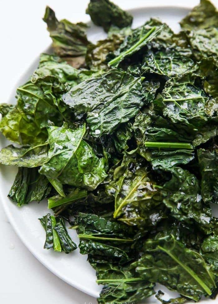 A pile of crispy kale chips on a plate