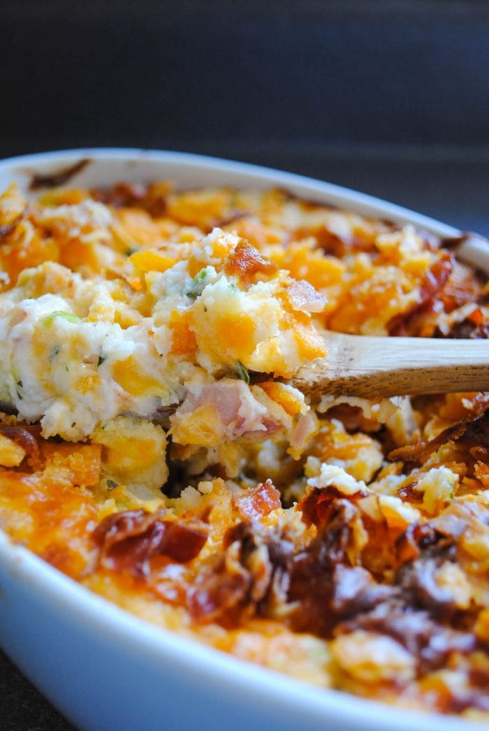 A loaded Thanksgiving leftover mashed potato bake in a white casserole dish