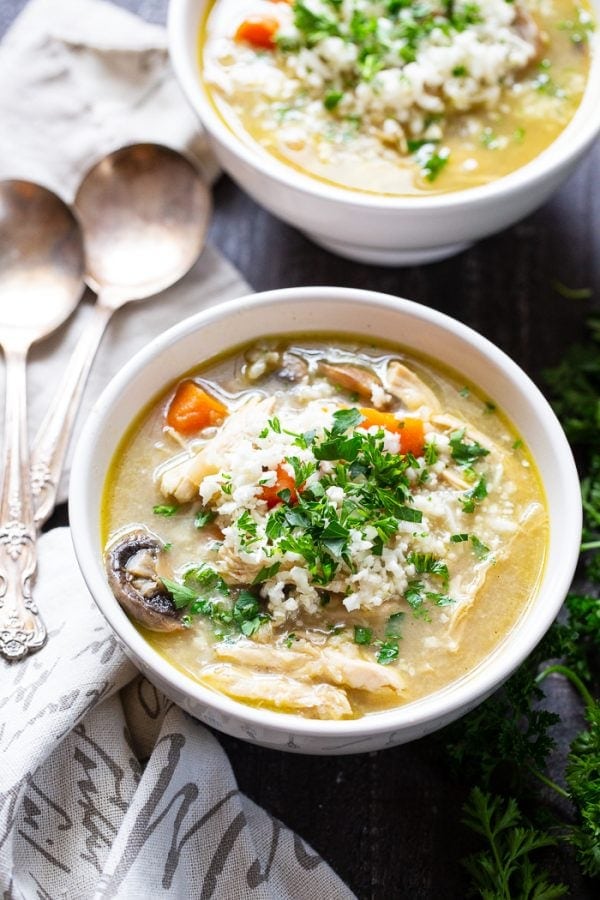 Whole30 Chicken rice soup in a white bowl